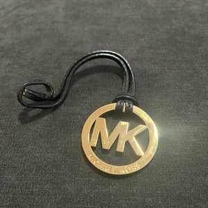 Michael Kors Purse Charm on Black and Gold - fair condition